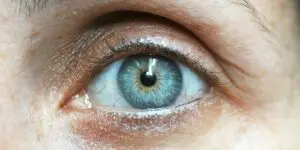 A close-up photograph of a human eye, representing the visual tracking techniques used in Eye Movement Desensitization and Reprocessing (EMDR) therapy to help clients process underlying trauma and psychological triggers during addiction treatment.